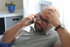 small business owner on phone confused about cash flow forecast