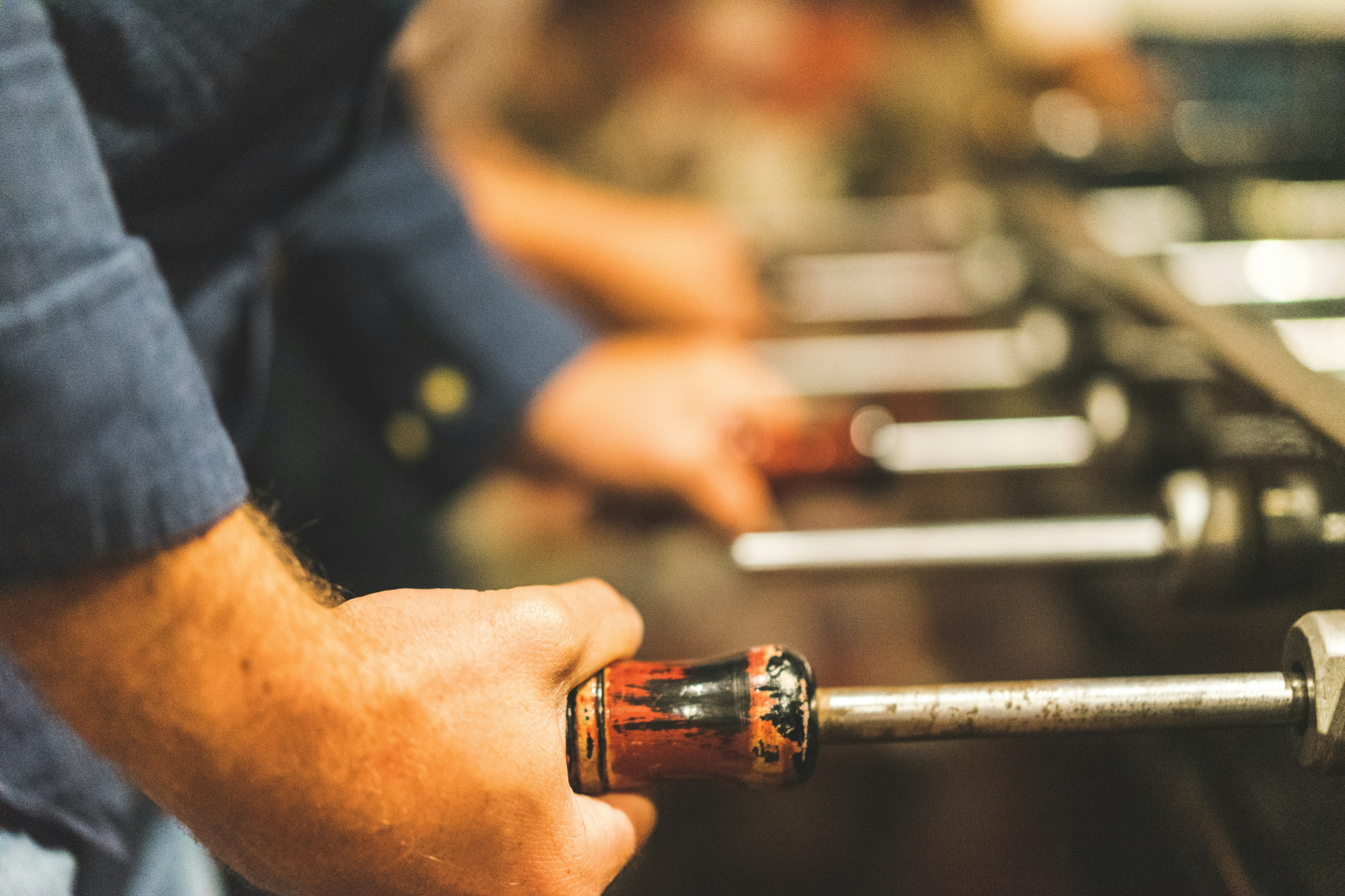 Business owner pulling profit levers including a drip campaign to grow a small business