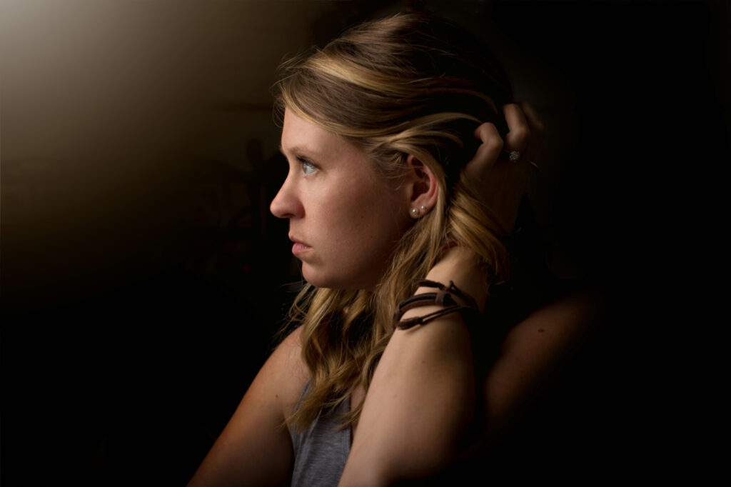 Woman business owner deep in thought, turning over how to grow my business when she's the one slowing it down.