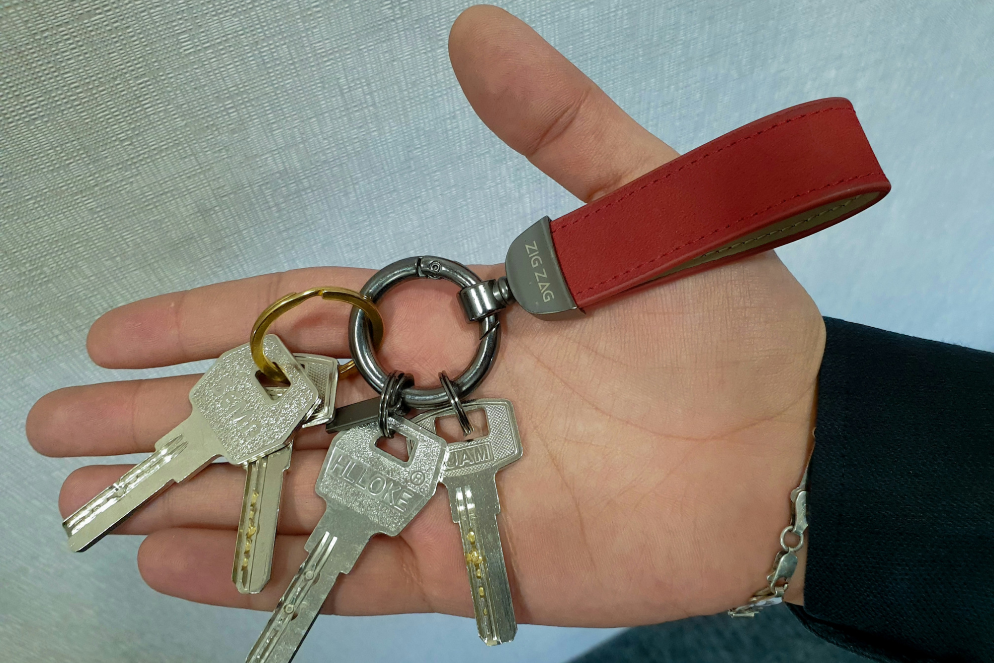 An open hand holding out several keys, the moment a small business owner hands over access and takes on the IT risks that come with it.